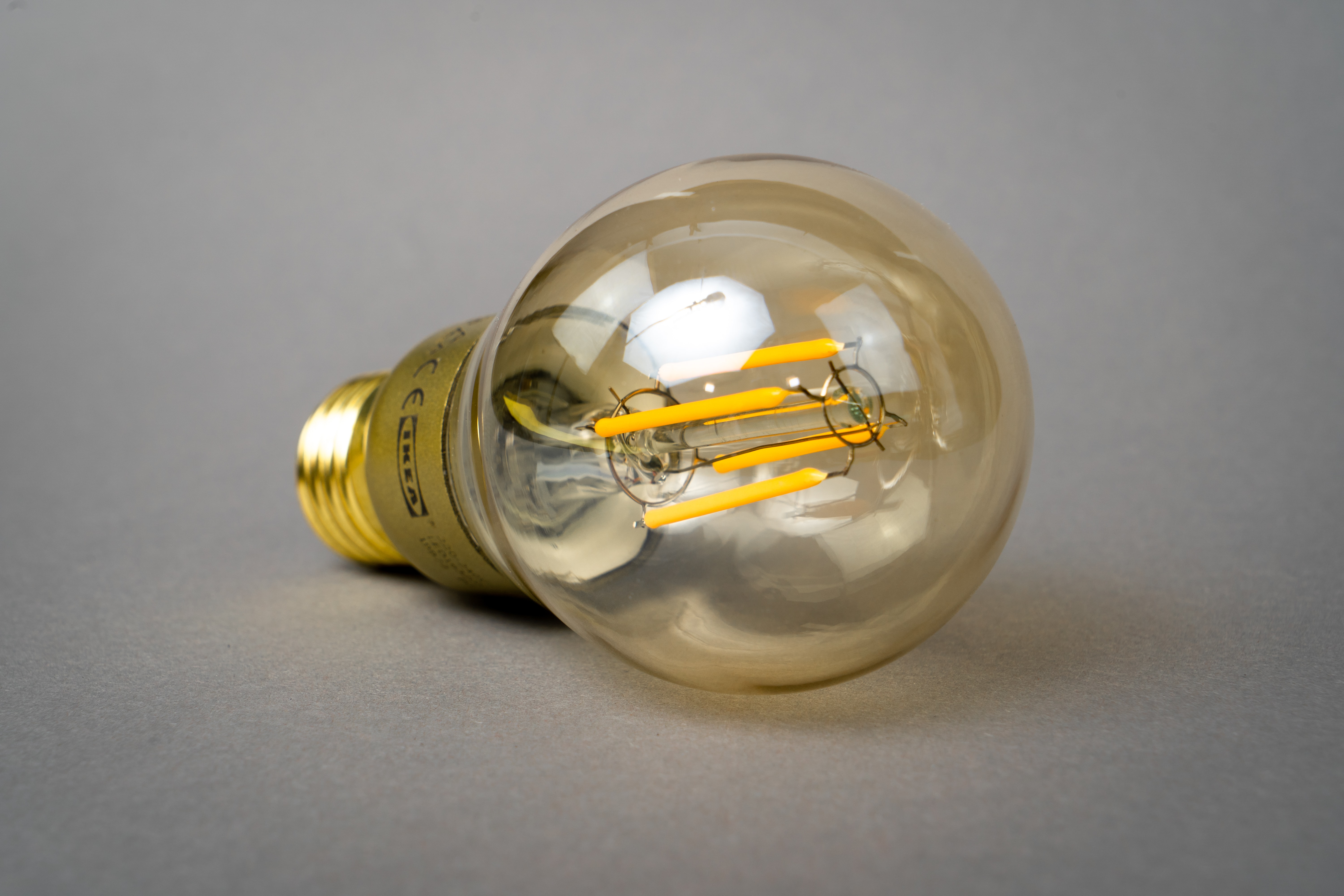 LED light bulb laying on a flat surface on its side